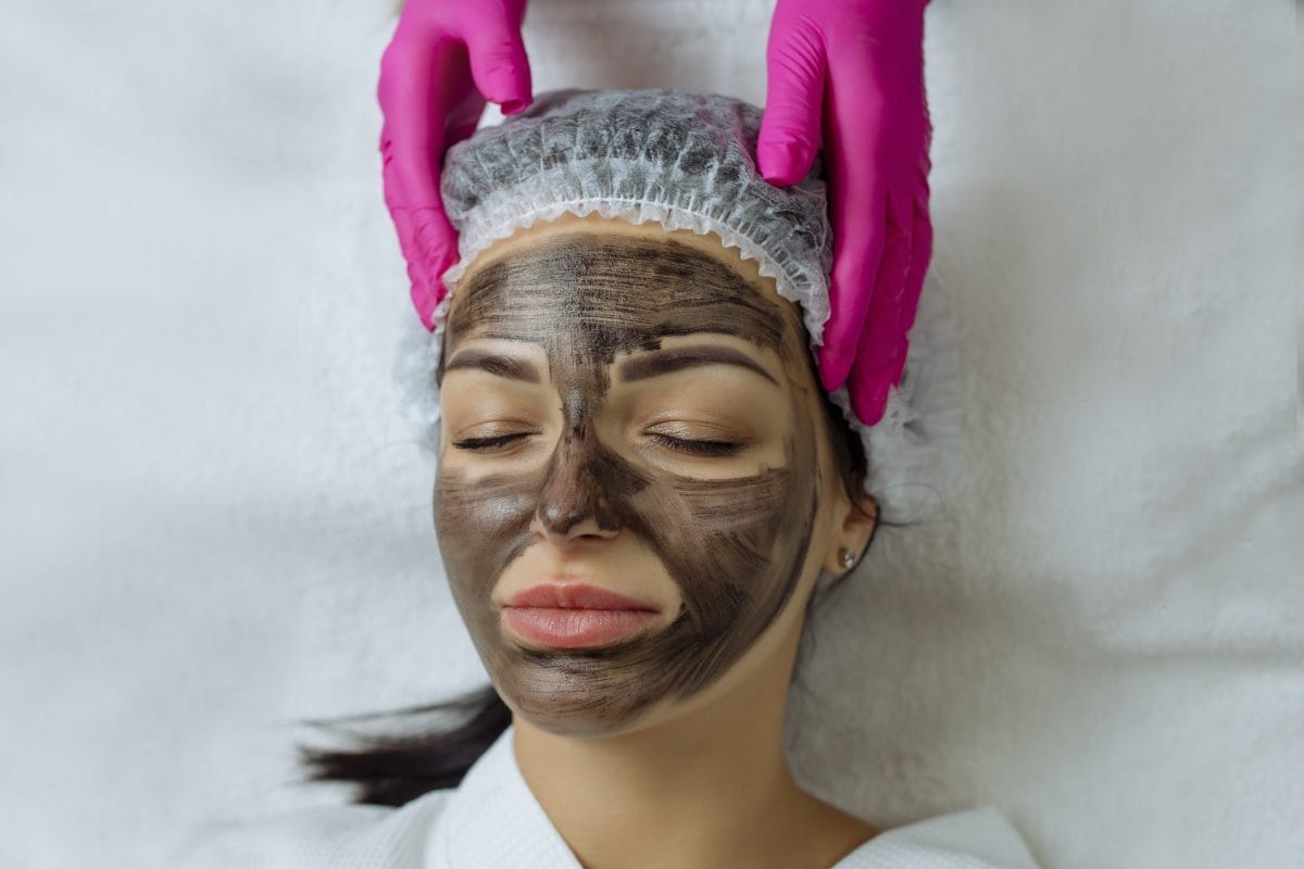 close up of carbon peeling procedure for middle aged woman face. laser pulses clean skin. process of photothermolysis, warming, laser carbon peeling. facial skin rejuvenation, cosmetology treatment.