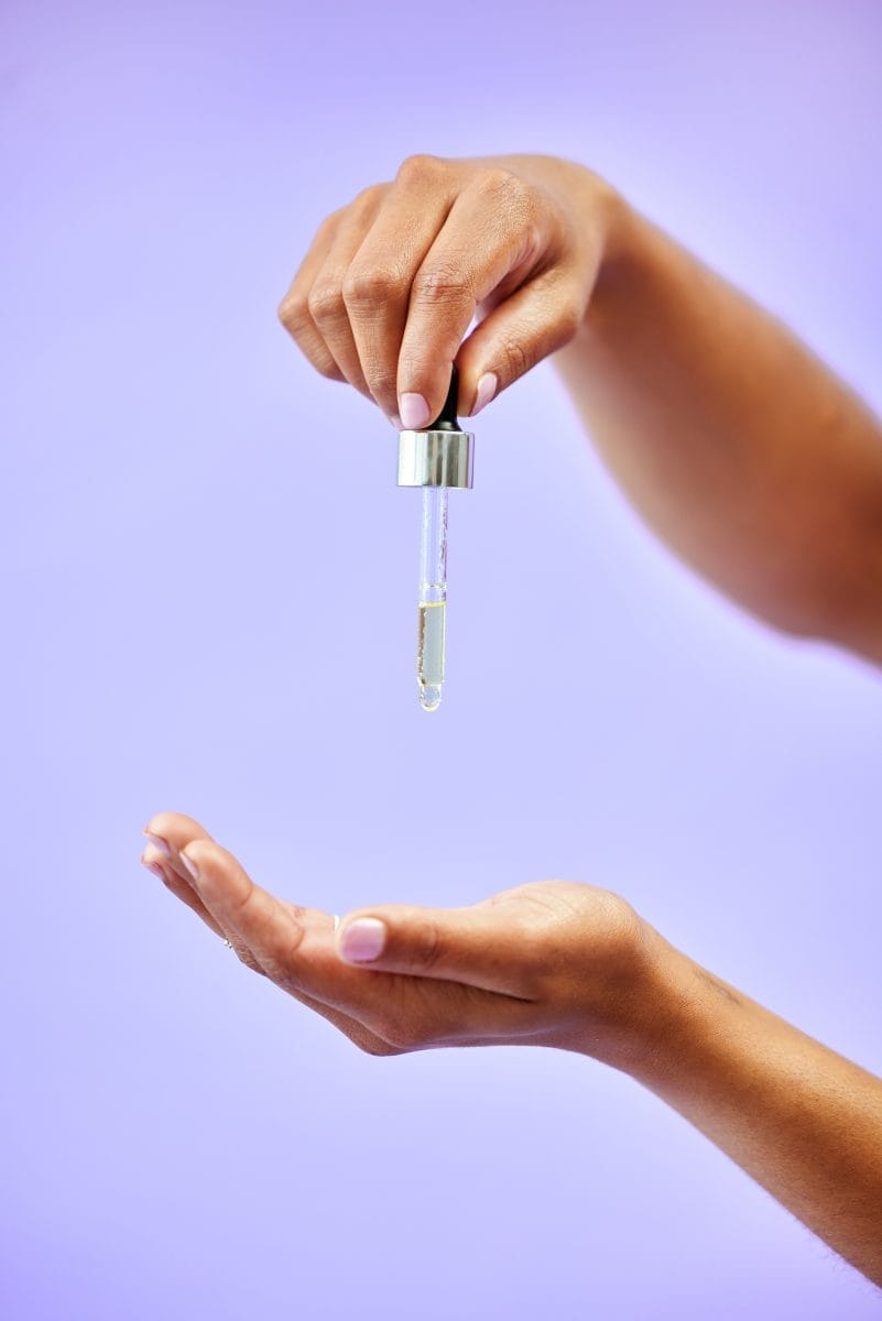 skincare hands and woman with oil in studio for w 2023 11 27 05 36 35 utc