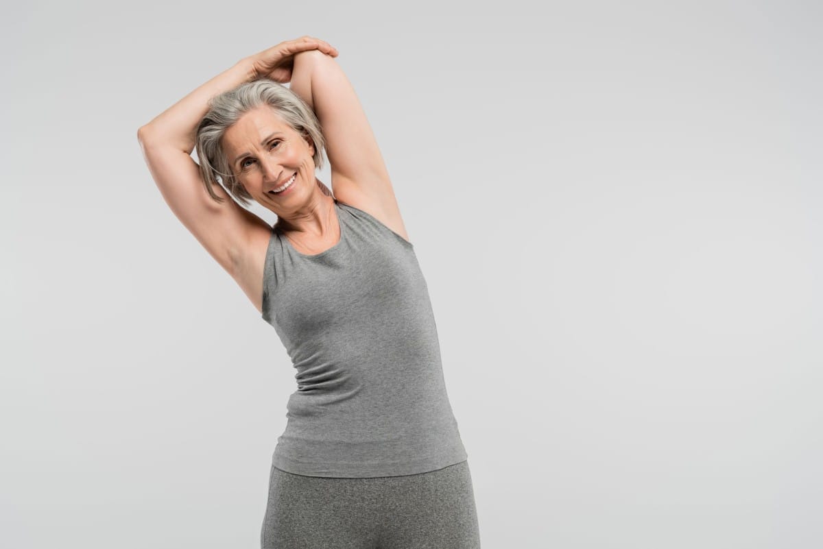 cheerful grandmother in sportswear exercising and 2023 11 27 05 01 11 utc