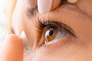 close up woman applying contact eye lens 2023 11 27 05 18 14 utc