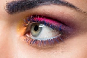 cropped shot of woman with colorful eyeshadows