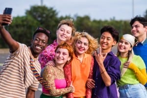 group of teenagers having a fun time outdoors together