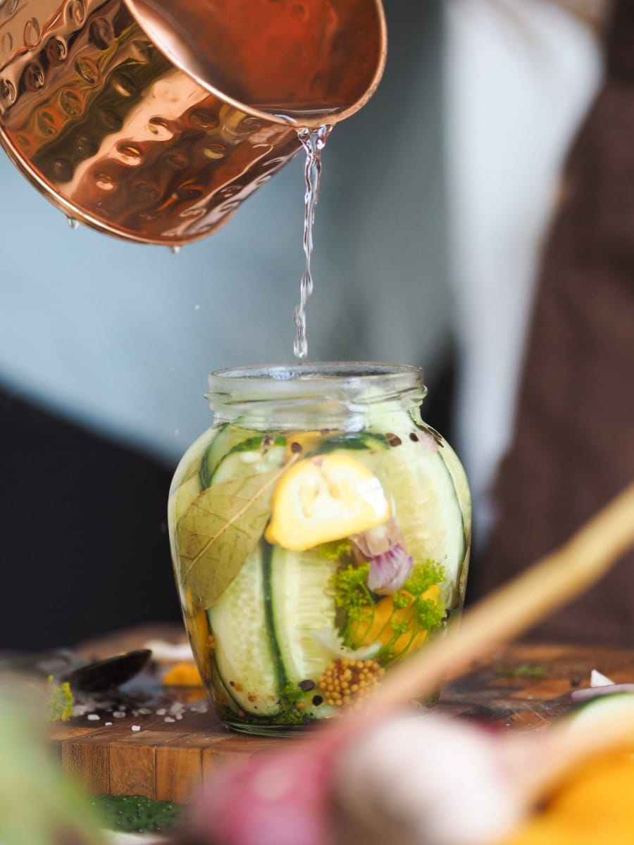 close up of a glass jar with vegetables on a white 2023 11 27 04 53 52 utc