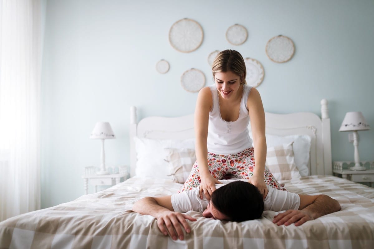 portrait of young loving couple in bedroom