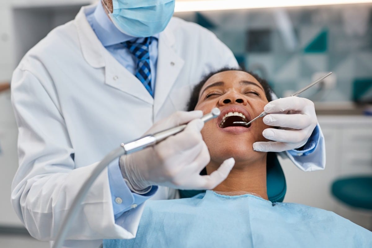 african american woman having teeth examination du 2023 11 27 05 18 56 utc