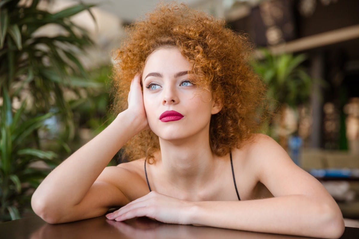 thoughtful woman sitting at the table in restauran 2023 11 27 05 13 47 utc