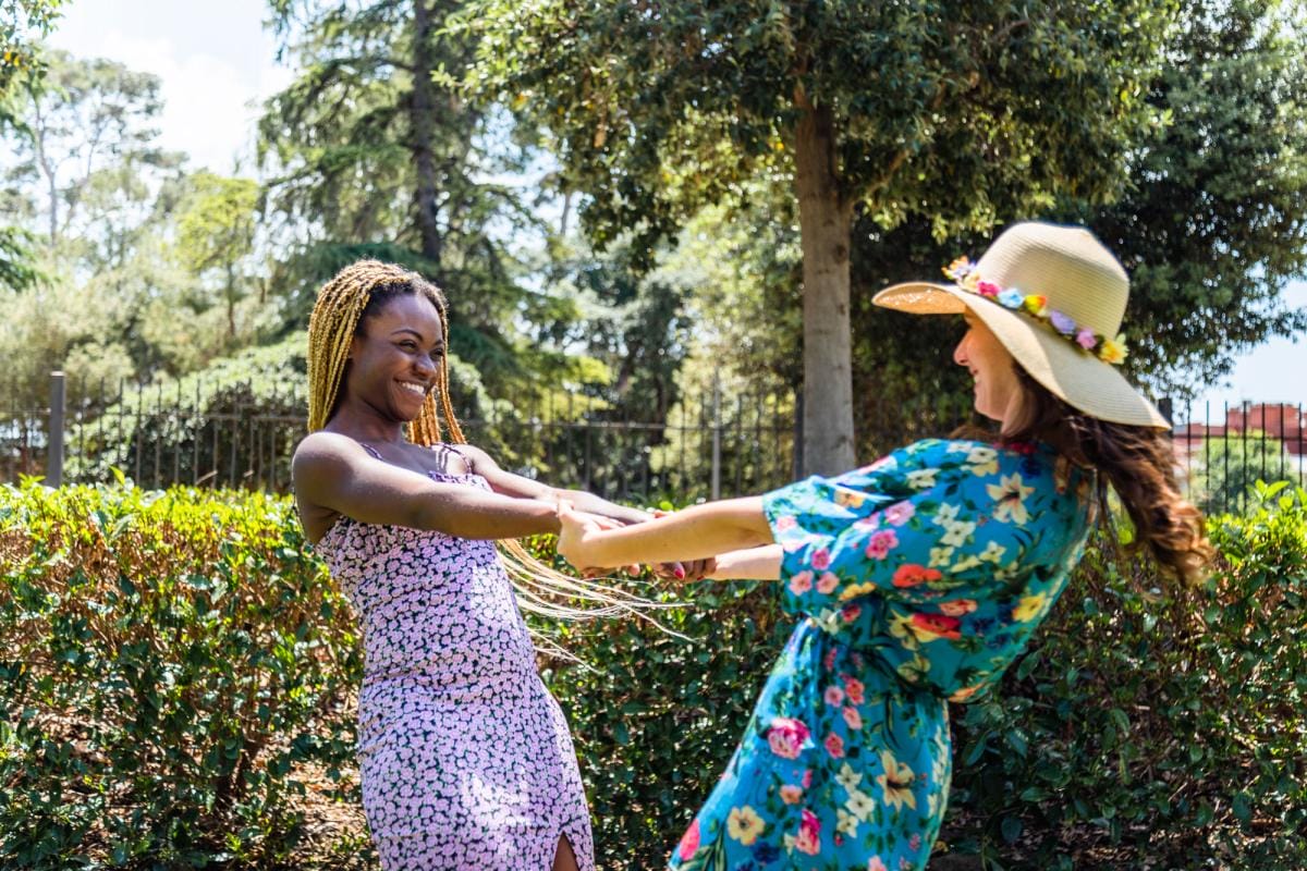 happy multiracial lesbian couple holding hands and 2023 11 27 05 08 43 utc