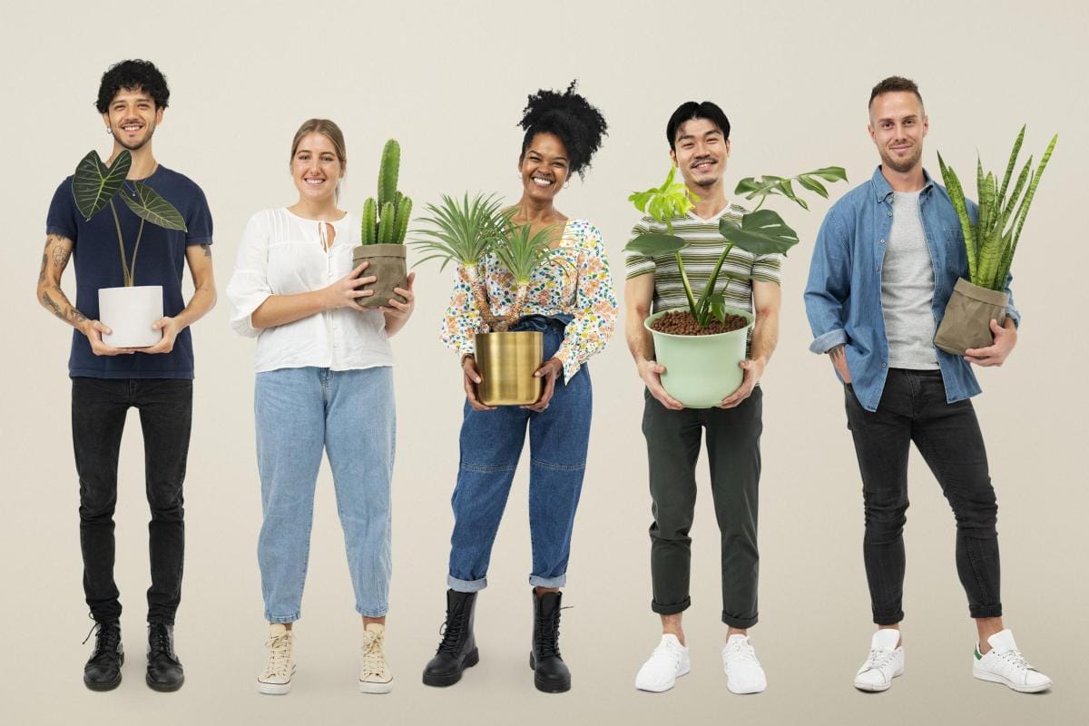 happy plant lovers holding their potted plants 2023 11 27 05 30 08 utc