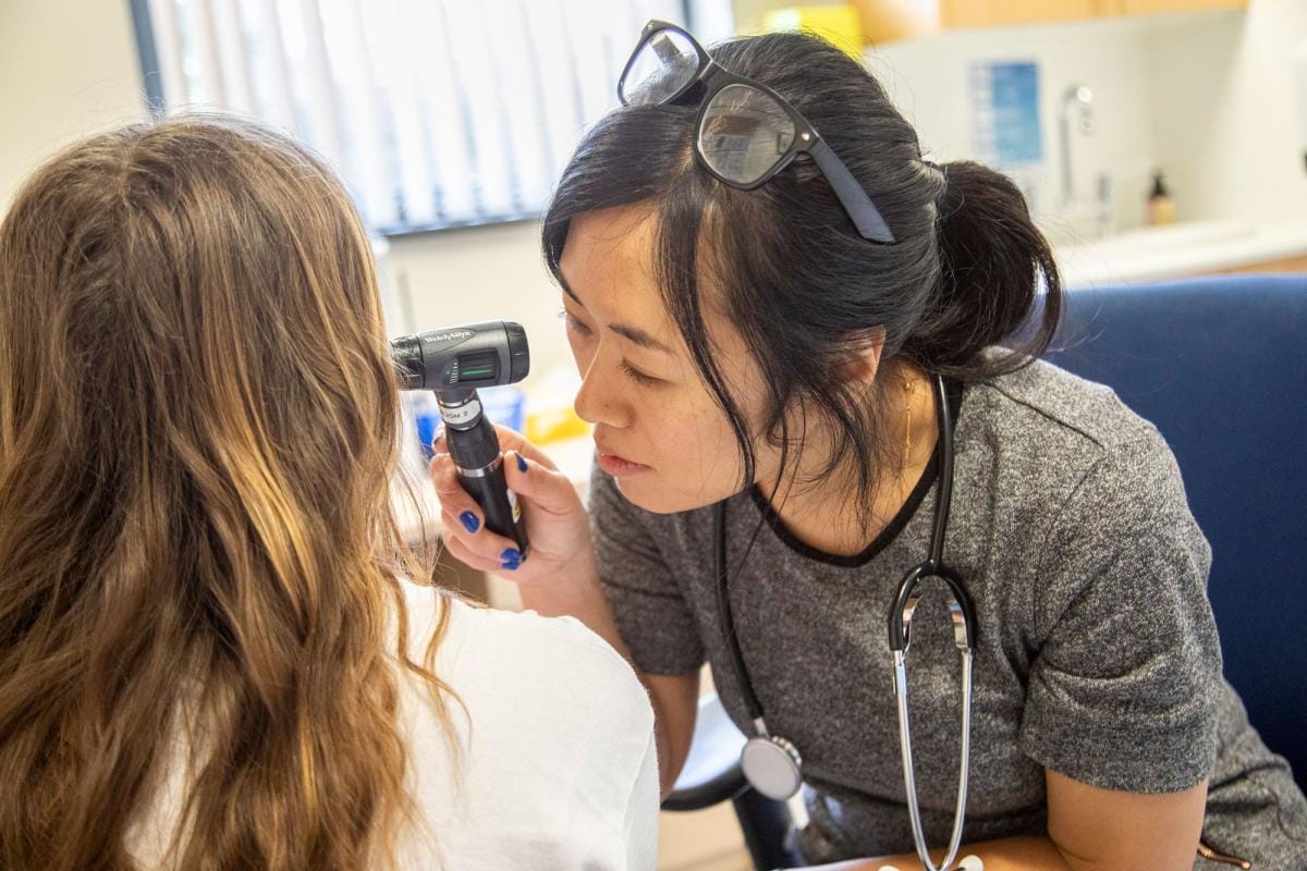 doctor performing an ear examination on a patient 2024 08 19 22 44 52 utc