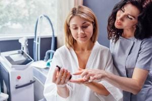 Nurse assisting patient with medication in clinic