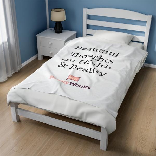 Branded duvet on bed in minimalist blue bedroom