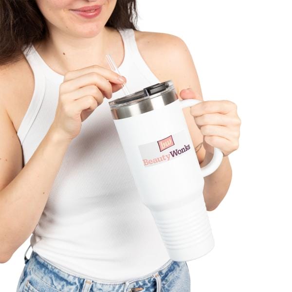 Woman holding white tumbler with Beauty Wonks logo