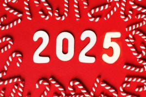 2025 surrounded by candy canes on red background