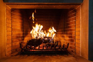 Bright fire burning in a brick fireplace