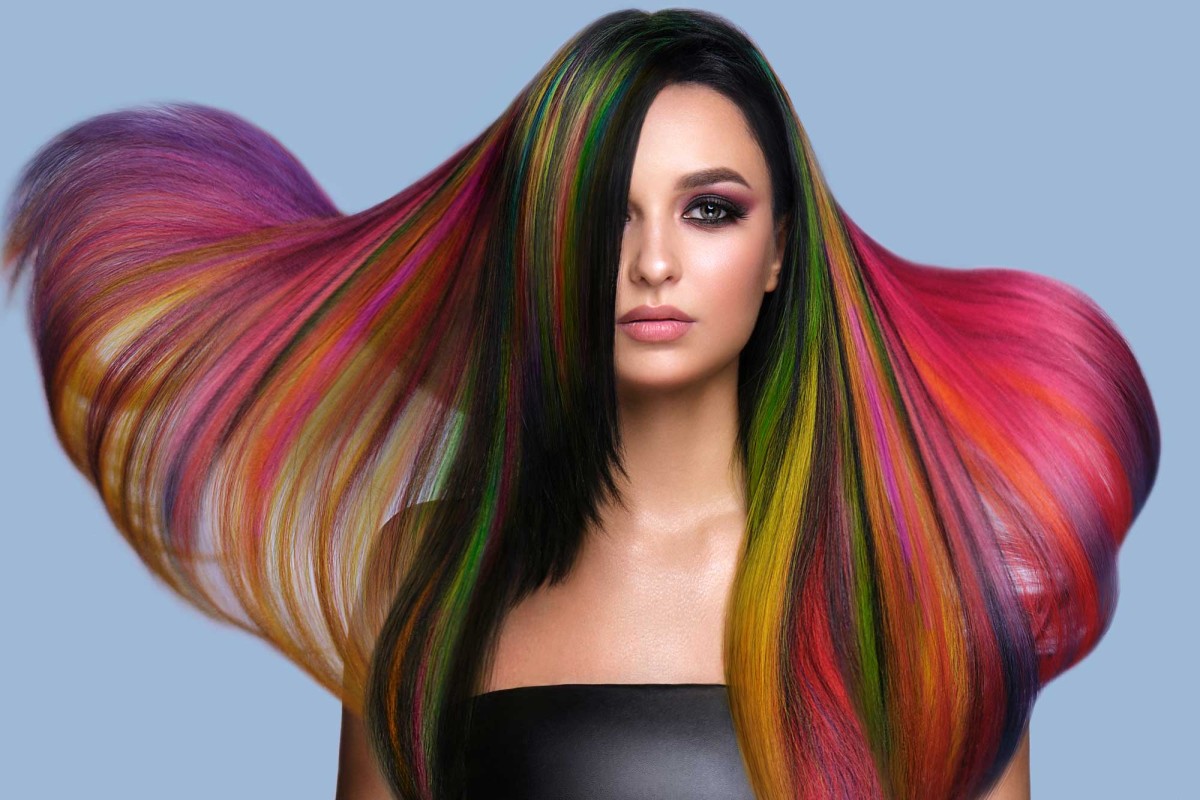 Woman with vibrant multi-colored flowing hair