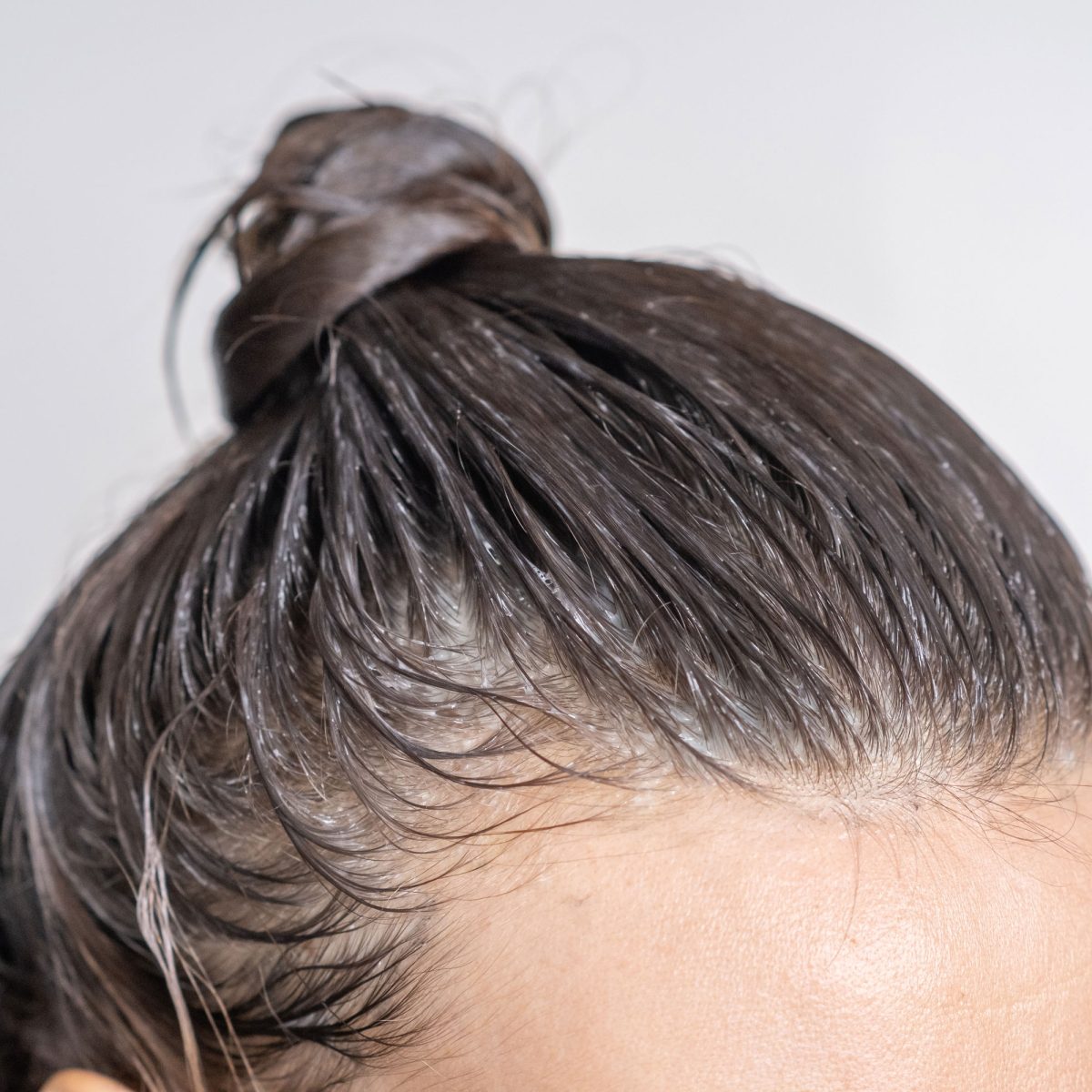 Close-up of wet hair tied in a bun